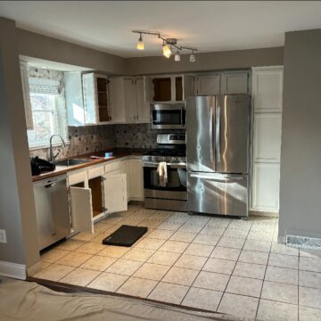 before kitchen with new flooring and cabinets