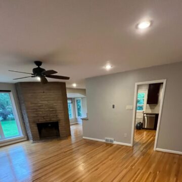 New living room with vaulted ceilings and exposed beams